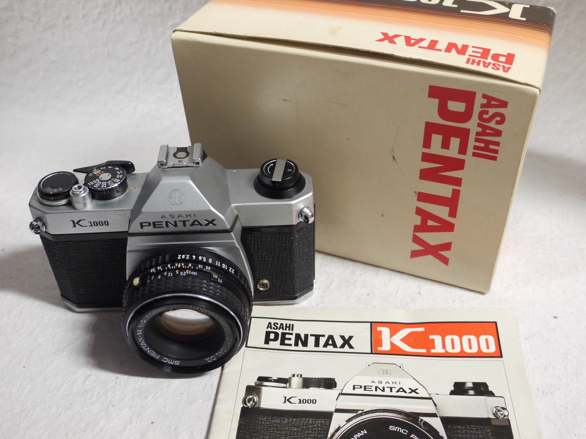 mwclassiccameras-20250124-281 Pentax K1000 35mm SLR body, chrome + 50mm f2 SMC Pentax-M lens, Instructions + Pentax Box