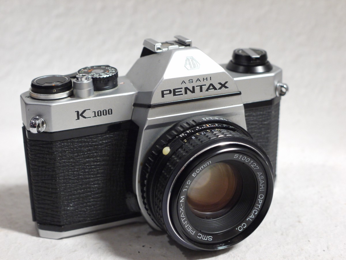 mwclassiccameras-20250124-282 Pentax K1000 35mm SLR body, chrome + 50mm f2 SMC Pentax-M lens, Instructions + Pentax Box