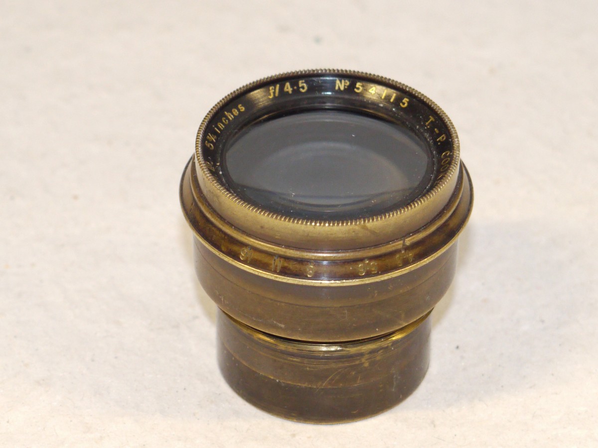 mwclassiccameras-20250131-80 Taylor Hobson 5 3/4 inch f4.5 T-P Cooke Anastigmat brass lens with gold lettering, with Iris Diaphragm & makers front cap