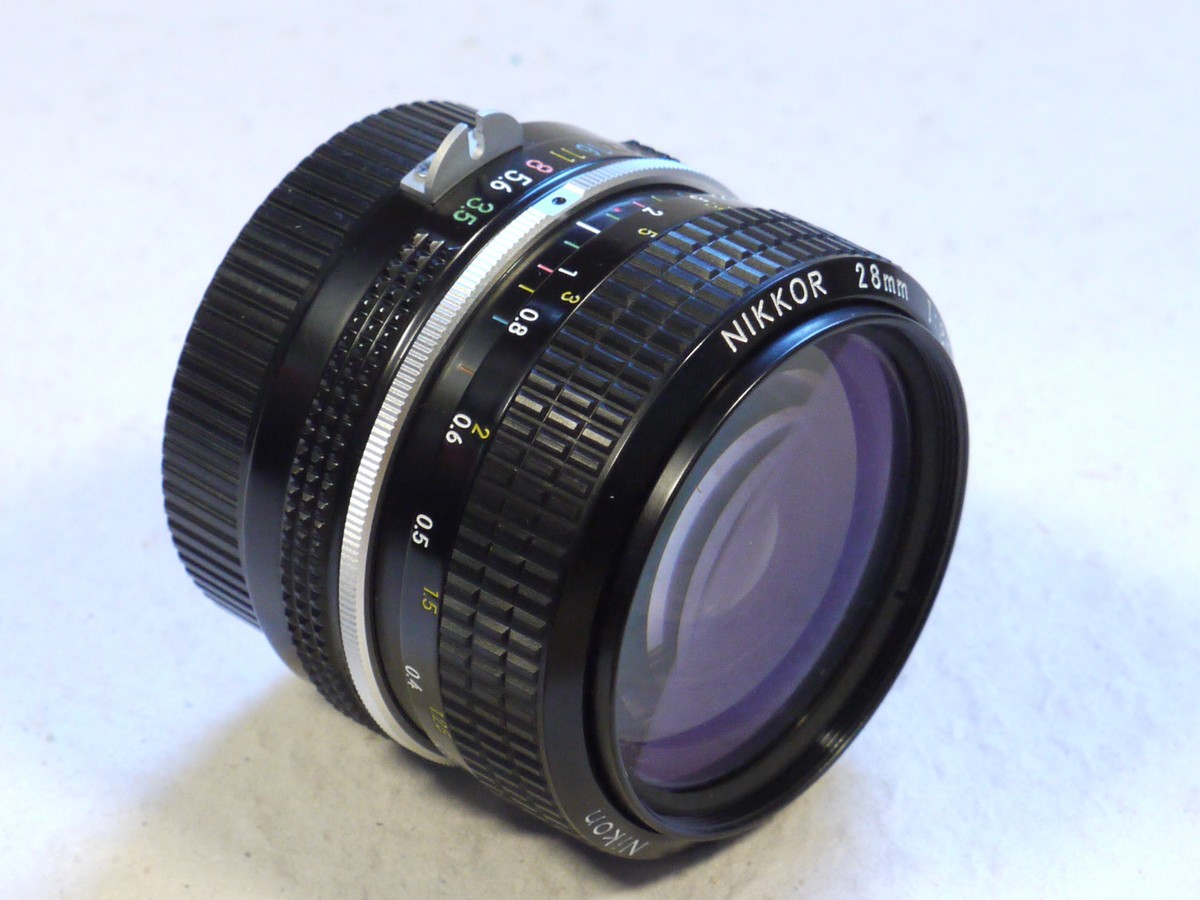 mwclassiccameras-20250207-37 Nikon 28mm f3.5 Nikkor manual focus PRE-AI lens, all black, later type + rear cap & case