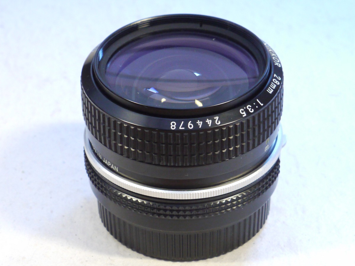 mwclassiccameras-20250207-39 Nikon 28mm f3.5 Nikkor manual focus PRE-AI lens, all black, later type + rear cap & case