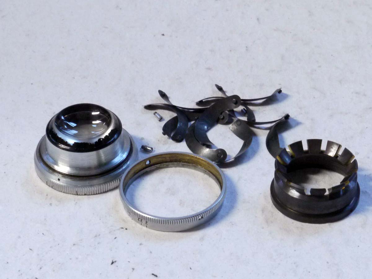mwclassiccameras-20250221-88 Leitz Incomplete lens. 5cm f2 Summar front lens part (No.353234) with Aperture ring & loose set of Iris Blades