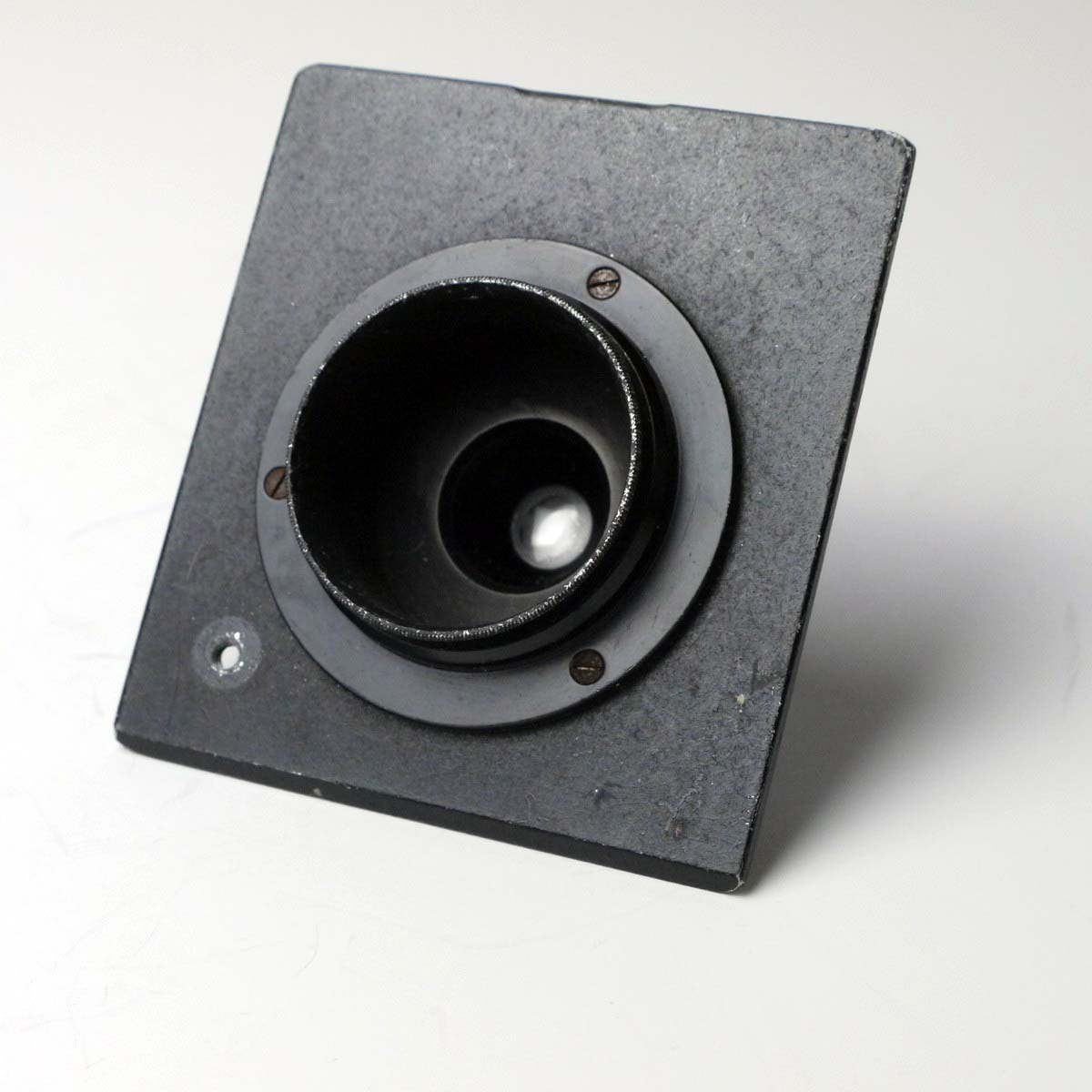 mwclassiccameras-20250307-189 Unamed 5.5cm f4.5 lens with Iris diaphragm in a sunk mount metal panel. UNCOMMON