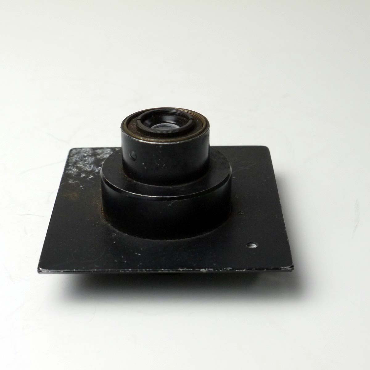 mwclassiccameras-20250307-190 Unamed 5.5cm f4.5 lens with Iris diaphragm in a sunk mount metal panel. UNCOMMON