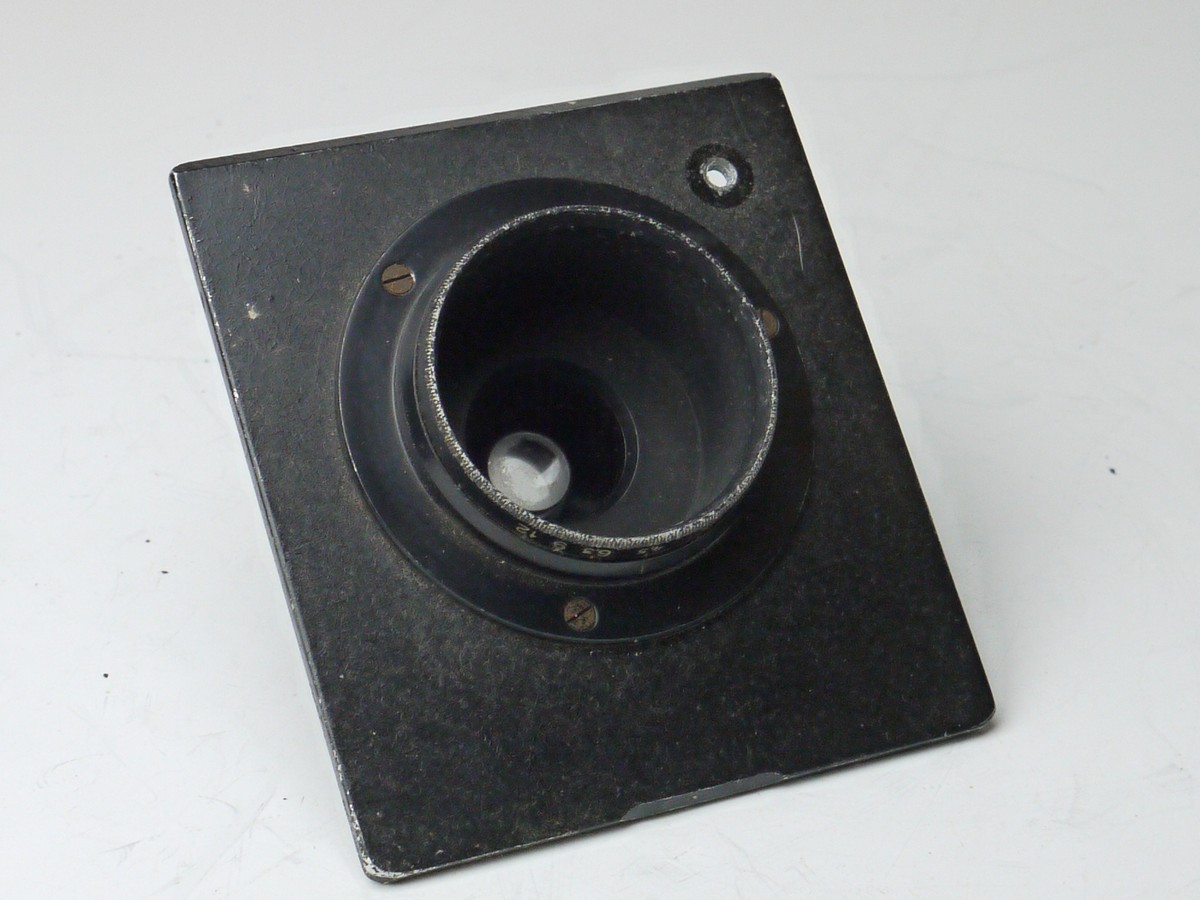 mwclassiccameras-20250314-188 Unamed 5.5cm f4.5 lens with Iris diaphragm in a sunk mount metal panel. UNCOMMON