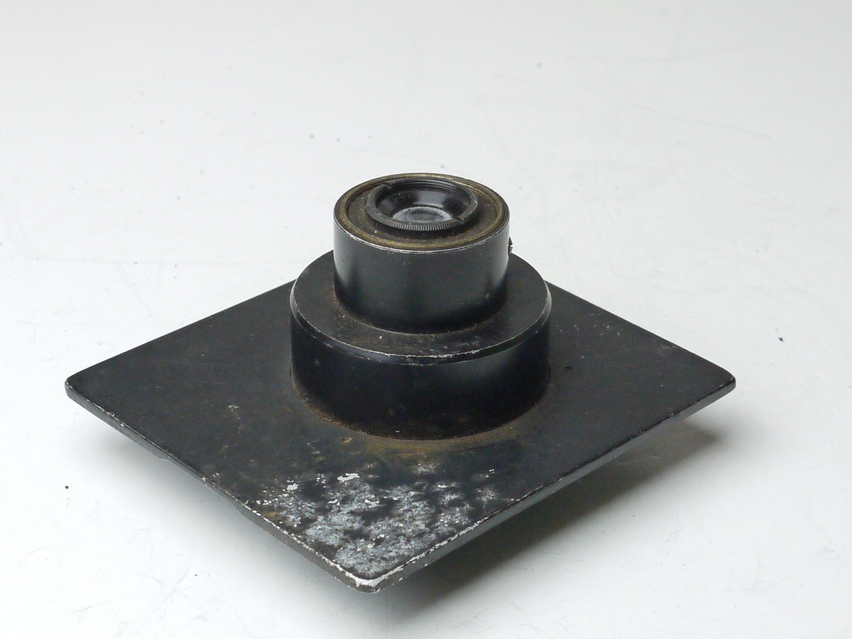 mwclassiccameras-20250314-189 Unamed 5.5cm f4.5 lens with Iris diaphragm in a sunk mount metal panel. UNCOMMON