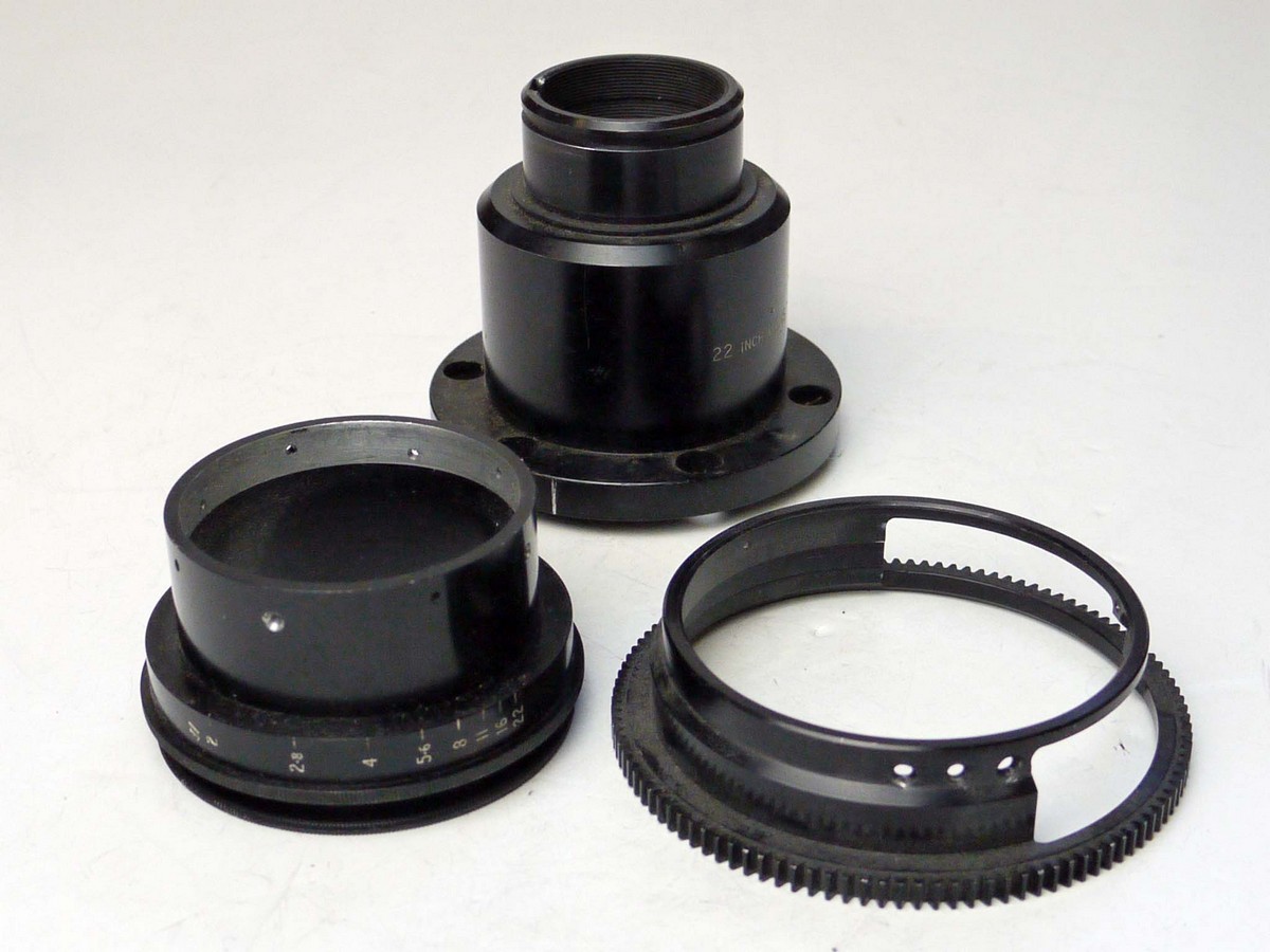 mwclassiccameras-20250328-140 Spare Parts for 35mm Cine lenses. Barrel with flange (marked "22 inch Lens"), Lens gear & lens barrelwith Aperture from T2.3-22