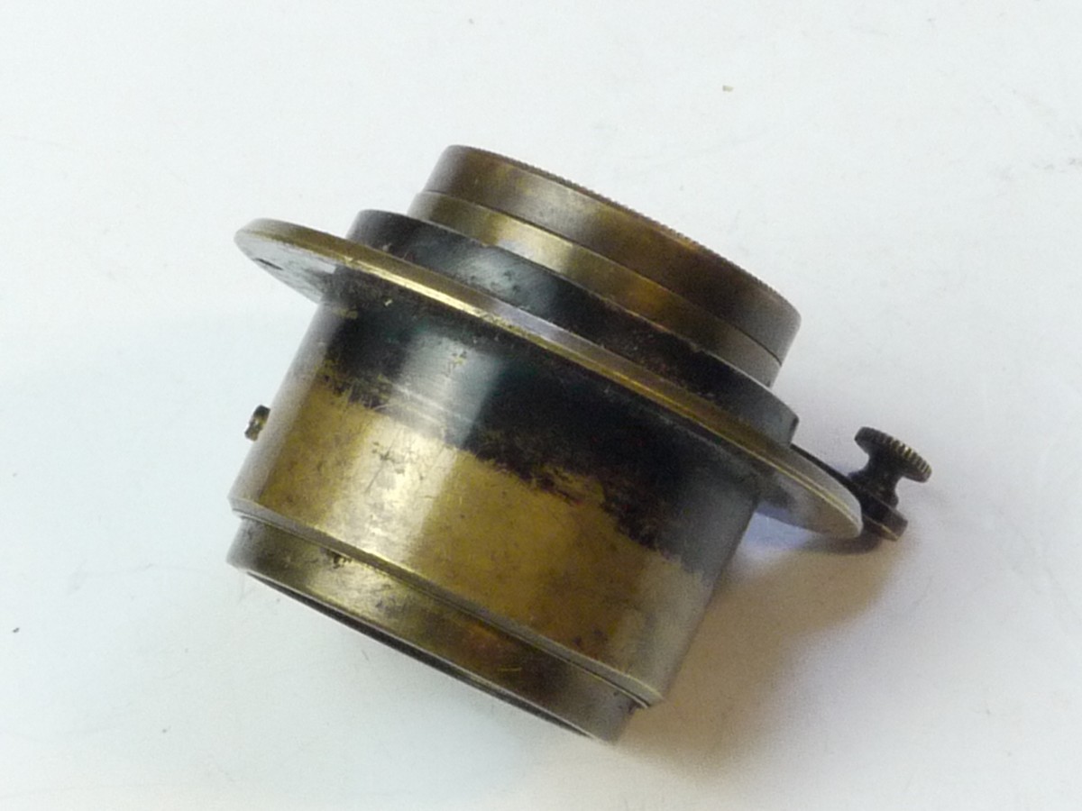 mwclassiccameras-20250502-166 H Roussel Extra Rapid Rectiliene brass lens with helicoid focusing & flange. Rear lens part & Iris Diaphragm are missing. SUITABLE FOR SPARE PARTS
