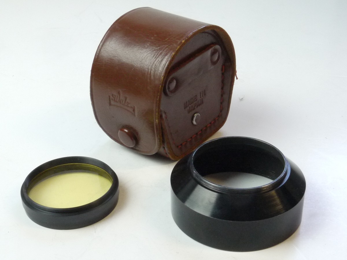 mwclassiccameras-20250502-188 Cook & Perkins 39mm Screw-in black metal lens hood + 39mm screw-in Pale Yellow filter. Both in Walz fitted brown leather outfit case