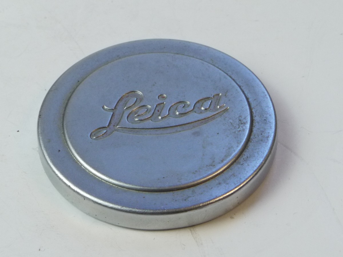mwclassiccameras-20250509-56 Leica Original 42mm Push-On chrome front lens cap (suitable for 50mm Summitar & Summicron Collaspsible Lenses). Shallow type with slightly raised centre & with Red felt inlay