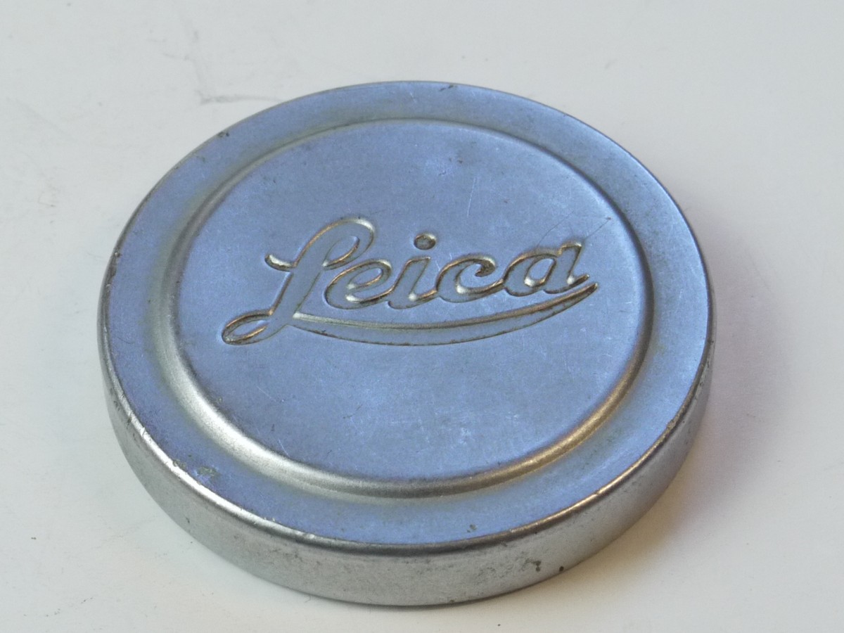 mwclassiccameras-20250509-60 Leica Original 42mm Push-On chrome front lens cap (suitable for 50mm Summitar & Summicron Collaspsible Lenses). Shallow type with slightly raised centre & with Red felt inlay