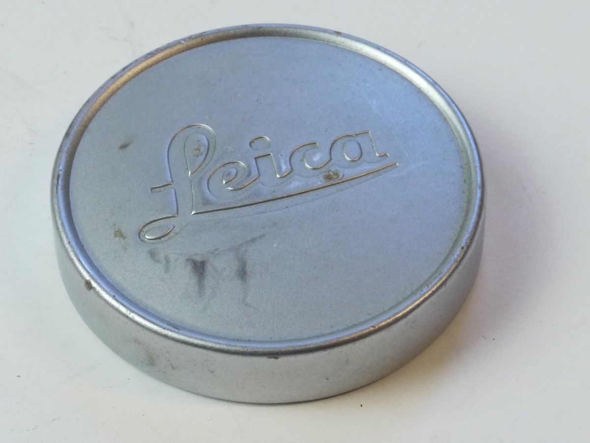 mwclassiccameras-20250509-62 Leica Original 42mm Push-On chrome front lens cap (suitable for 35 & 50mm Summicron lenses). Deeper Type With Red felt inlay