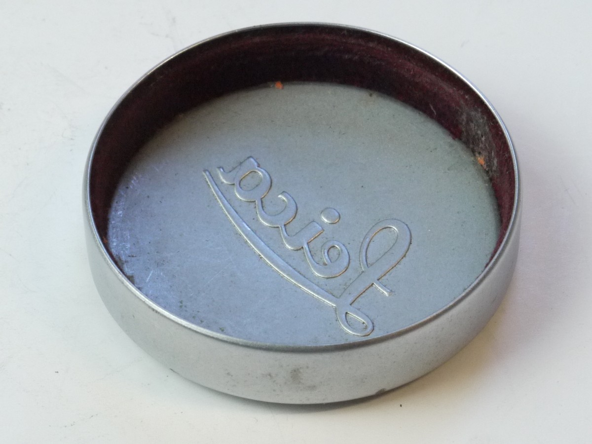 mwclassiccameras-20250509-63 Leica Original 42mm Push-On chrome front lens cap (suitable for 35 & 50mm Summicron lenses). Deeper Type With Red felt inlay