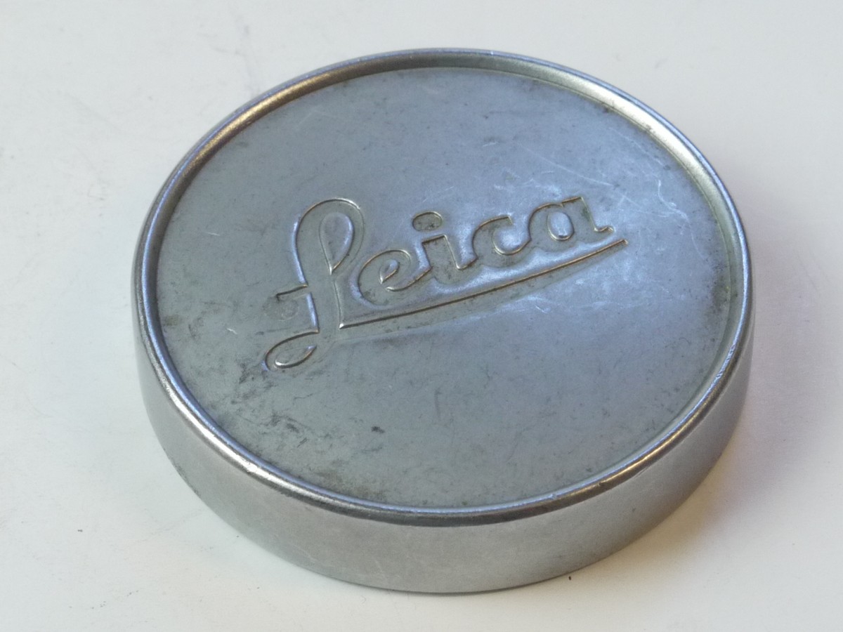 mwclassiccameras-20250509-64 Leica Original 42mm Push-On chrome front lens cap (suitable for 35 & 50mm Summicron lenses). Deeper Type With Red felt inlay