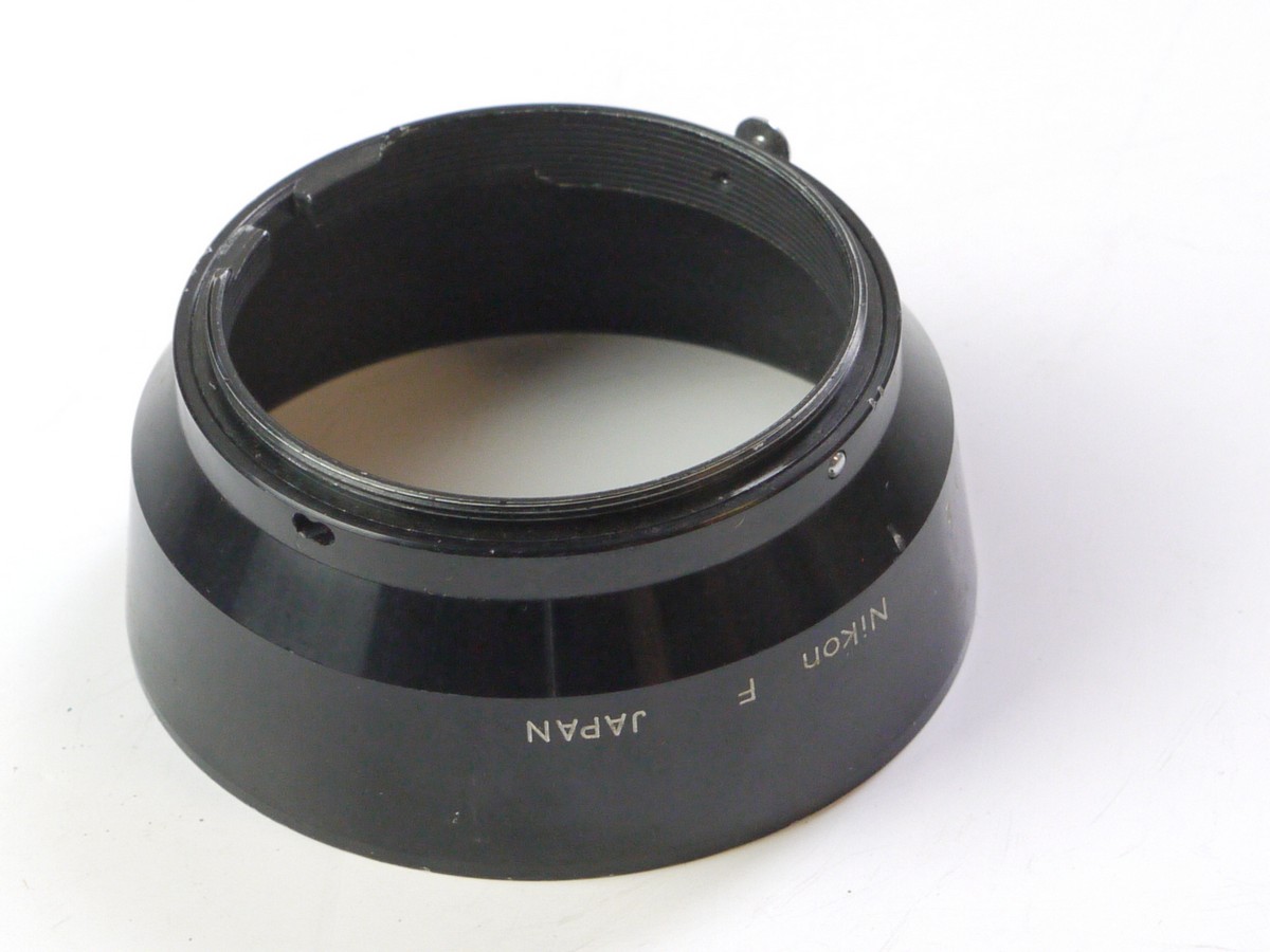 mwclassiccameras-20250523-35 Nikon Clip-On metal lens hood for the 5cm f2 Nikon F lens. Early type with single metal Spring Grip