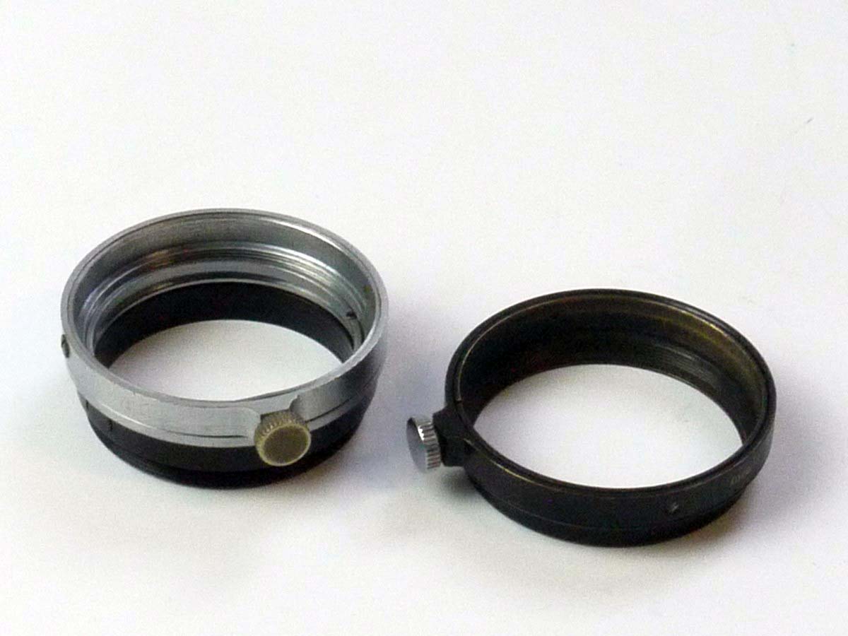 mwclassiccameras-20250530-158 Leitz Set of Two filter outer metal rings (One A36 black metal rings with fixing screw & Another A36 Chrome metal out ring withg added front part)