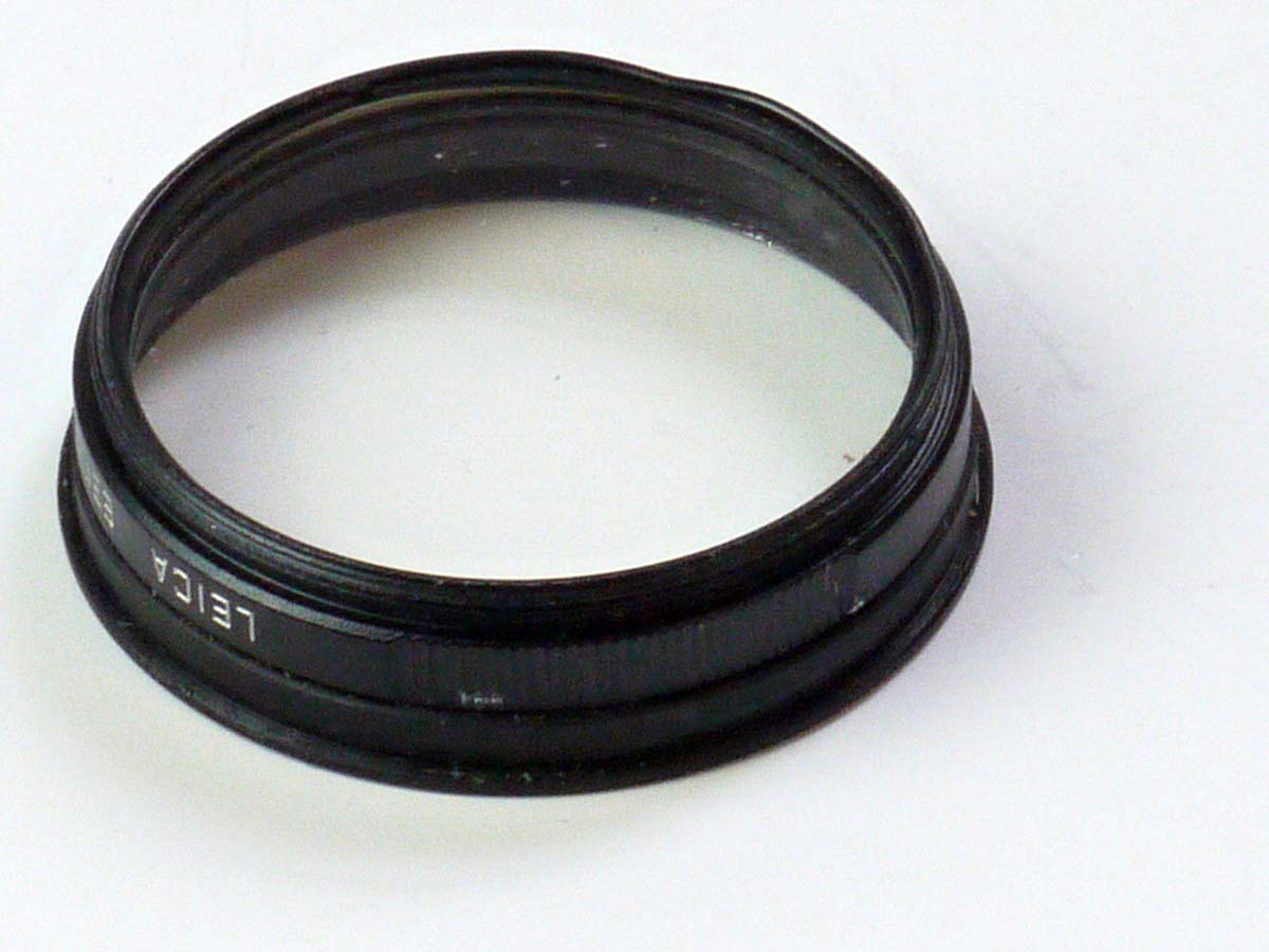 mwclassiccameras-20250530-169 Leica E39 UVa filter black rim (13131) with an E39 to E41 step-up ring glued onto the front (we cannot remove it)