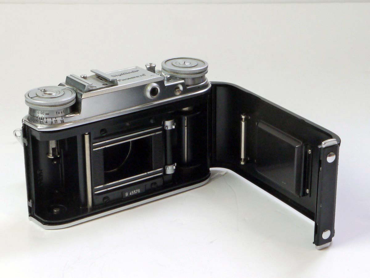 mwclassiccameras-20250530-31 Voigtlander Prominent I 35mm Coupled Rangefinder camera body, knob-wind + 50mm f3.5 Color-Skopar interchangeable lens, VL front cap & ER case