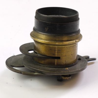 Unamed brass lens with rotating wheel aperture & built-in metal guilotine type shutter