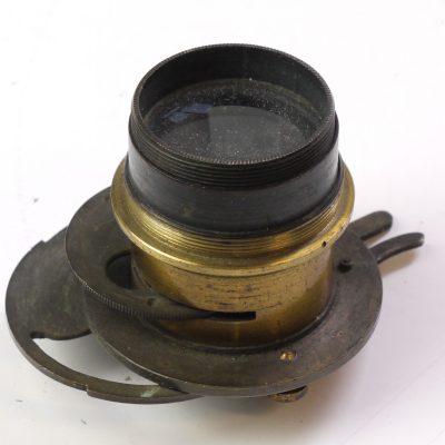 Unamed brass lens with rotating wheel aperture & built-in metal guilotine type shutter