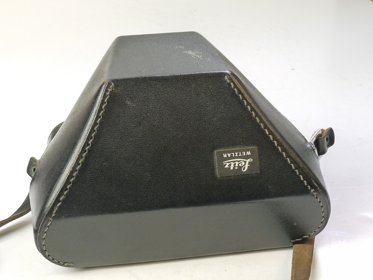 mwclassiccameras-20250620-335 Leitz Black leather ER case with strap for M4, with small tripod mount & enlarged front.