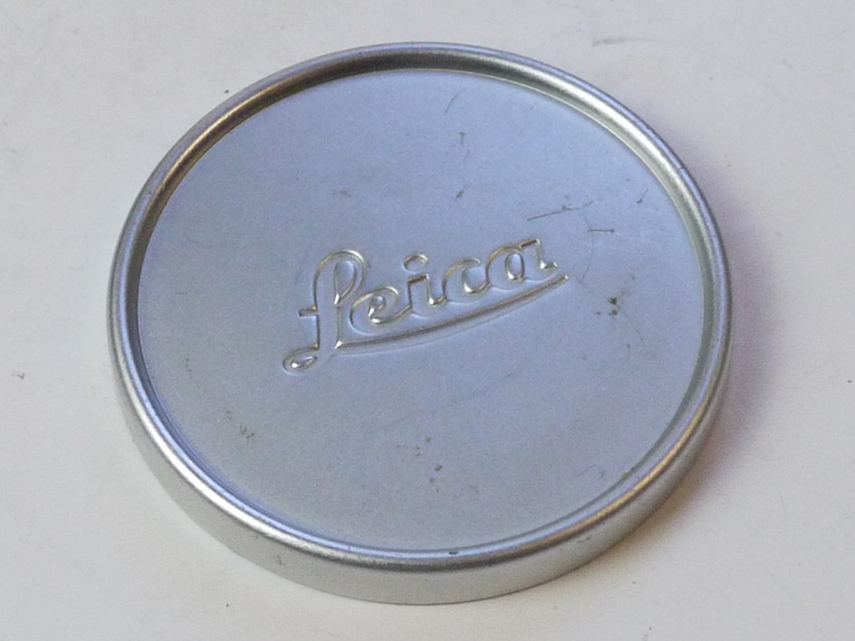mwclassiccameras-20250711-226 Leitz "Leica" 56mm Push-on chrome front lens cap with edge ridge & red felt edge inlay