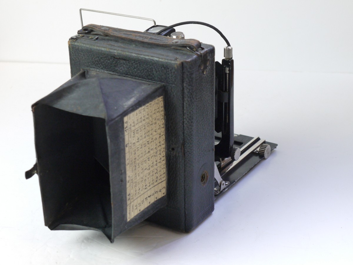 mwclassiccameras-20250718-162 Unbranded 8x11cm Strut Folding Bed plate camera with Ground Glass Back, 5 Plate backs, Exposure Calculator disc, Schneider 13.5cm f4.5 Xenar lens in Compur shutter & leather outfit case