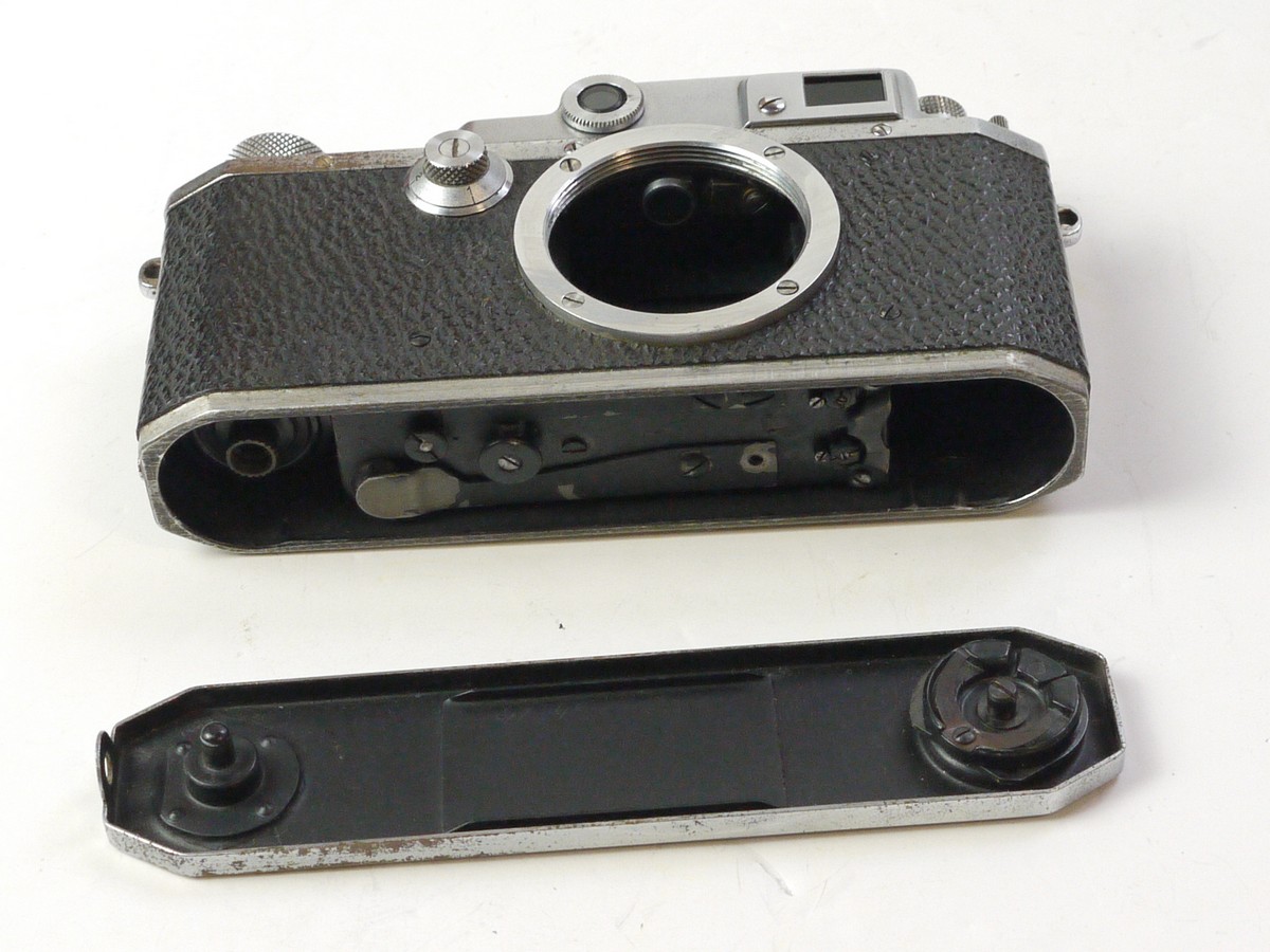mwclassiccameras-20250725-30 Canon IIB body (No.34963) c1949-51, "Made in Occuped Japan" engraved on the base. L39 Screw mount Leica Copy with 3-frame combined viewfinder/rangefinder + Canon ER case. This is a later version with centred screw fitting on the rear body