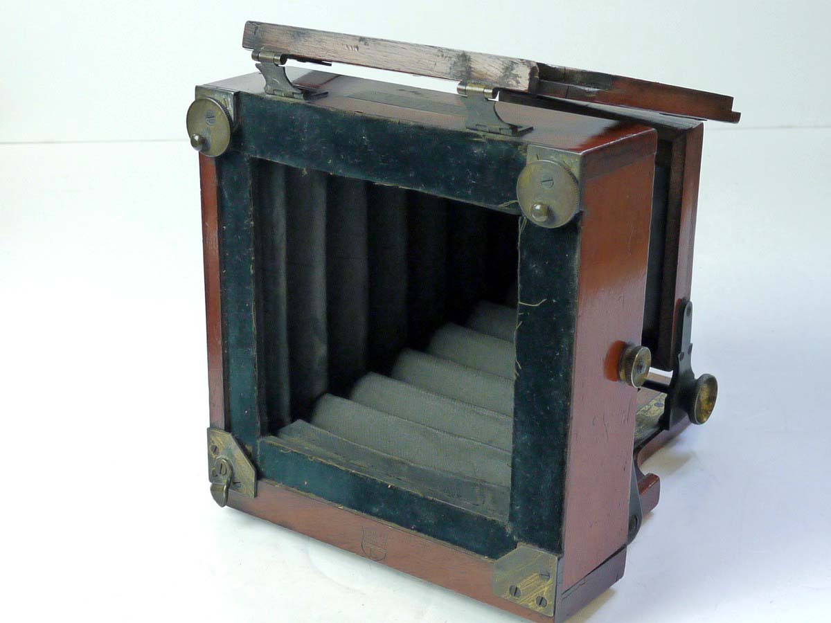 mwclassiccameras-20250801-61 Lancaster Le Merveilleux Mahogany 4 1/4 X 4 1/4 Folding Plate Camera with Glass Back, 1/4 Plate Holder & Originsal small ler size lens flange for the front panel. No Lens