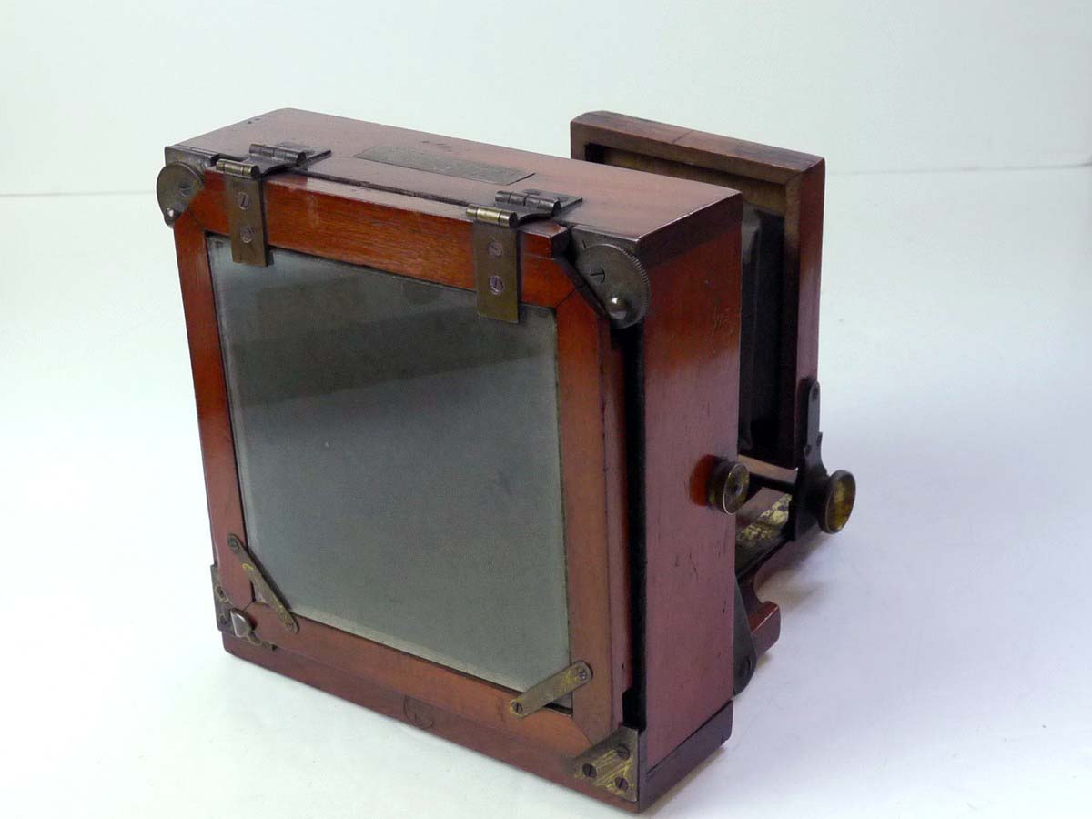 mwclassiccameras-20250801-62 Lancaster Le Merveilleux Mahogany 4 1/4 X 4 1/4 Folding Plate Camera with Glass Back, 1/4 Plate Holder & Originsal small ler size lens flange for the front panel. No Lens