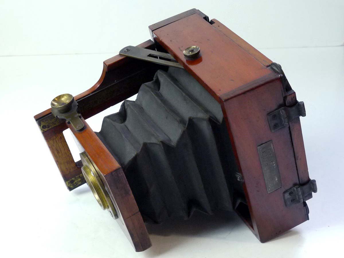 mwclassiccameras-20250801-64 Lancaster Le Merveilleux Mahogany 4 1/4 X 4 1/4 Folding Plate Camera with Glass Back, 1/4 Plate Holder & Originsal small ler size lens flange for the front panel. No Lens