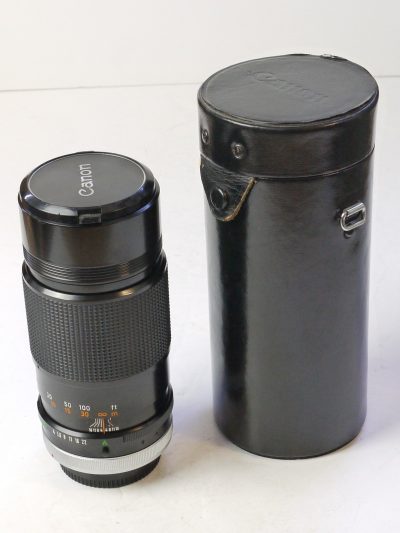 Canon 200mm f4 S.S.C. manual focus FD Breechlock mount lens with built-in lens hood, caps & case