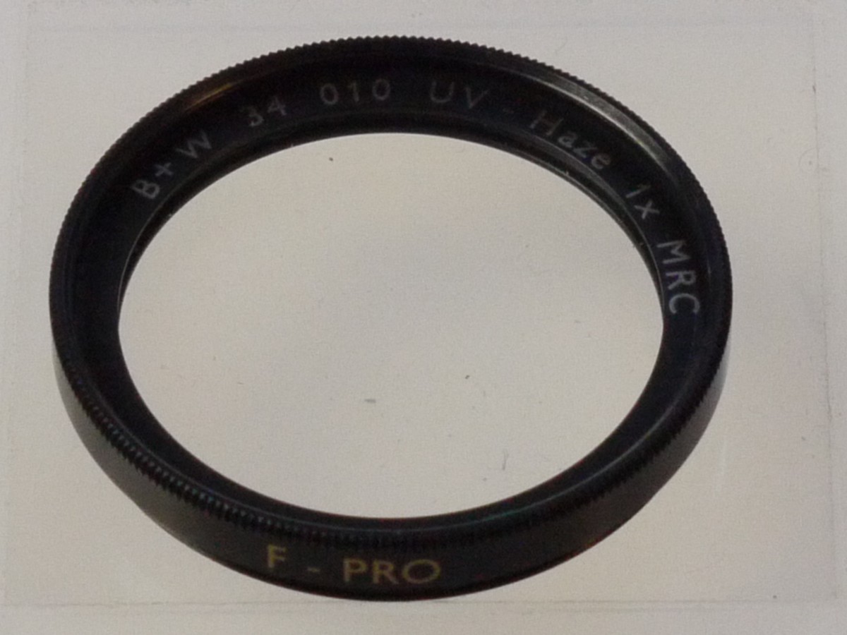 mwclassiccameras-20250808-211 B+W 34mm Screw-In UV-Haze 1X 010 MRC filter, black rim. With Keeper case. Can be screwd on and used with the Leica 50mm f2 Summar lens
