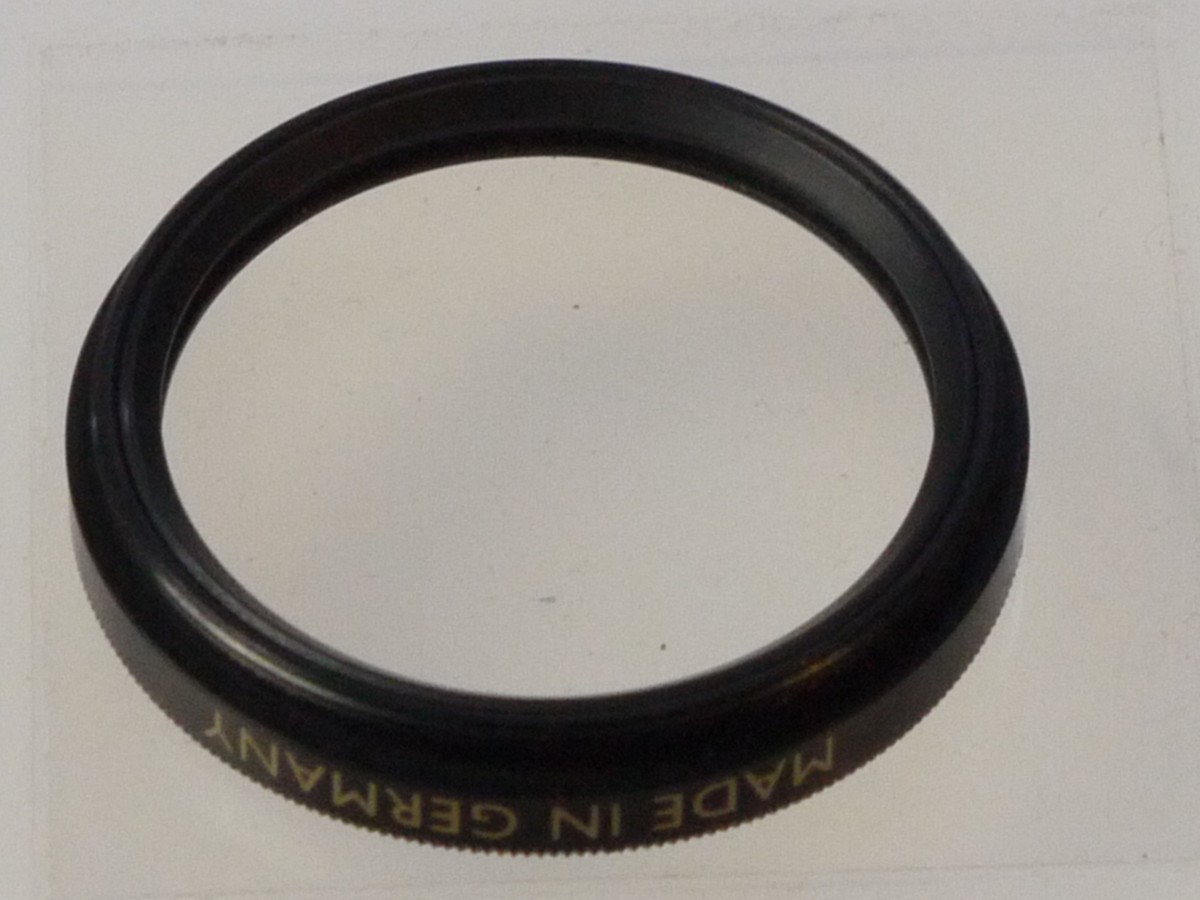 mwclassiccameras-20250808-212 B+W 34mm Screw-In UV-Haze 1X 010 MRC filter, black rim. With Keeper case. Can be screwd on and used with the Leica 50mm f2 Summar lens