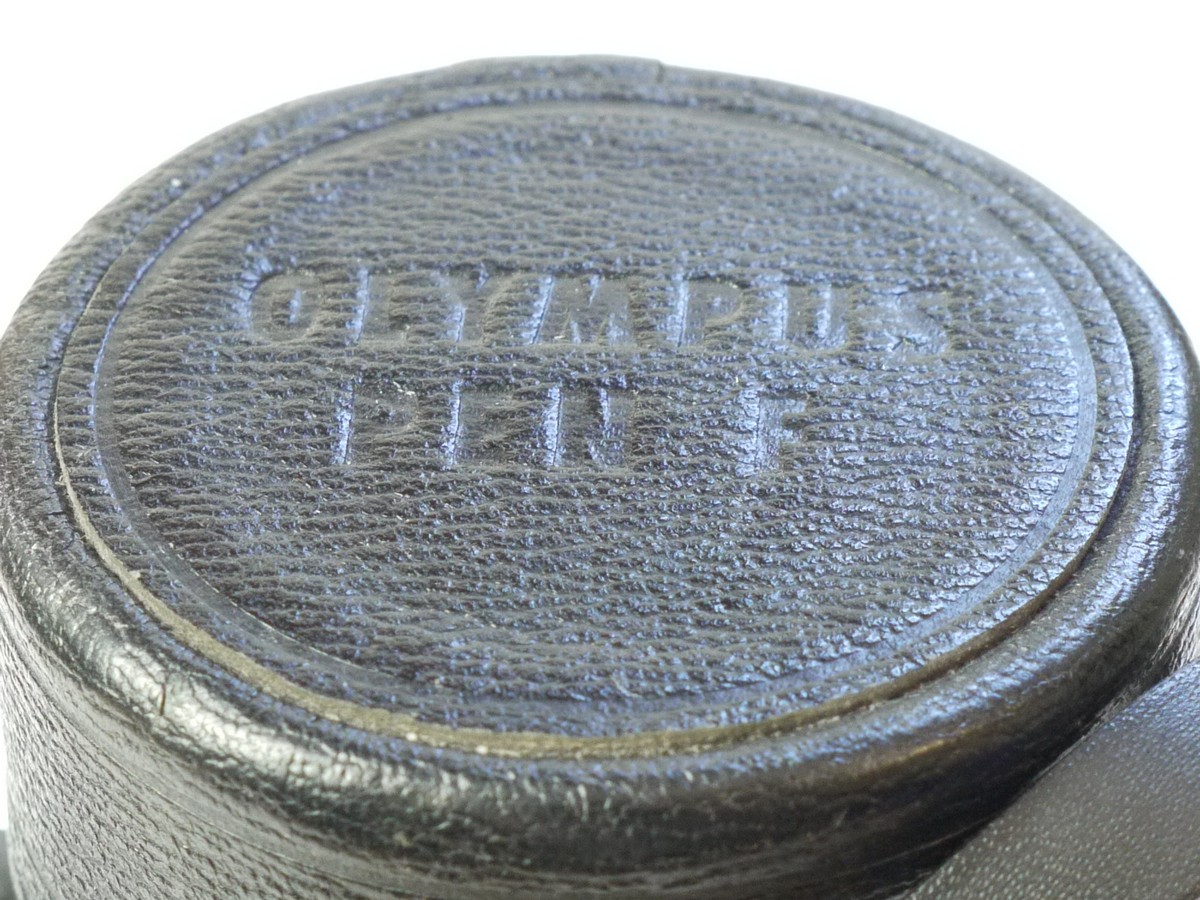 mwclassiccameras-20250815-38 Olympus Pen F black leather lens case with strap for long Telephoto lens, with strap (145x65mm)