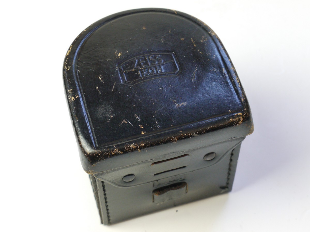 mwclassiccameras-20250822-66 Zeiss Ikon Black leather lens/Accessory case (23.1004), semi circular shaped, with filter holder on inside lid. 80mm x 75mm x 70mm
