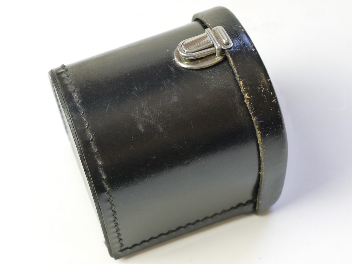 mwclassiccameras-20250822-67 Zeiss Ikon Black leather lens/Accessory case (23.1004), semi circular shaped, with filter holder on inside lid. 80mm x 75mm x 70mm