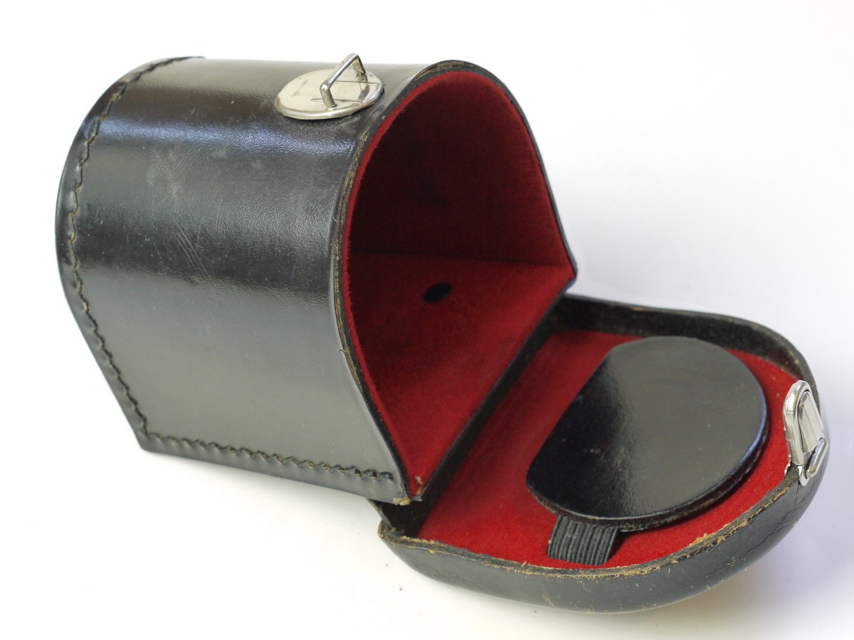 mwclassiccameras-20250822-68 Zeiss Ikon Black leather lens/Accessory case (23.1004), semi circular shaped, with filter holder on inside lid. 80mm x 75mm x 70mm