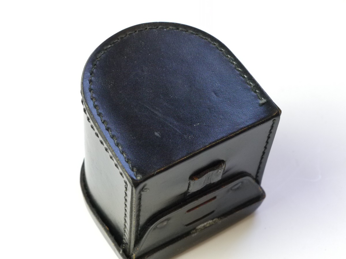mwclassiccameras-20250822-70 Zeiss Ikon Black leather lens/Accessory case (23.1004), semi circular shaped, with filter holder on inside lid. 80mm x 75mm x 70mm