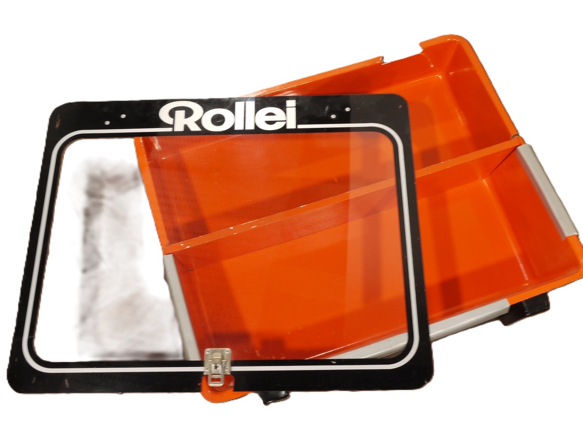 mwclassiccameras-20251030-325 Rollei Plastic Display Cabinet, Orange & Black coloured, with one wooden shelf & removable Clear front panel. 590 x 480 x 150mm