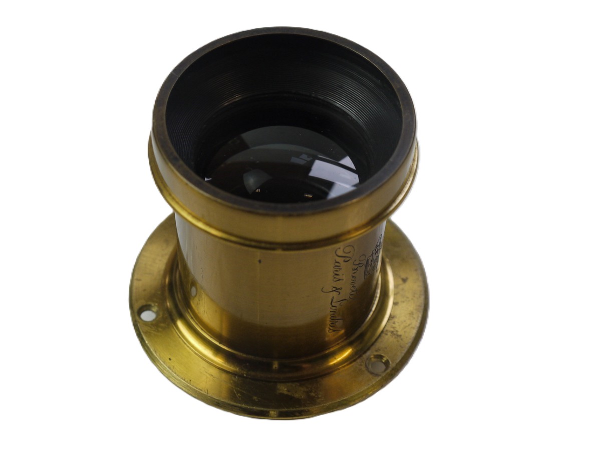 mwclassiccameras-20251030-46 Derogy No.3 Brass lens (Estimated 10 inch focal length) with Slot for Waterhouse Stops (No Stops included). With flange. Height is 60mm. Diameter is 45mm