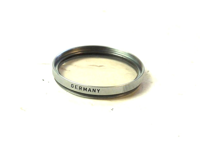 mwclassiccameras-20251114-83 Leitz E39 UV filter, chrome rim + Keeper case & Box. Engraved "Germany" only