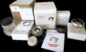mwc20251226-139 Mandler 35mm f2 7-Element NICKEL Leica M Mount lens (No. 064/100) Limited Edition of 100 only. With Front Cap, Keeper Case, Square Black lens Hood (12526), Round Chrome Lens Hood with Vents (12504), UVa Filter, All Boxed & with Lens Outer Box