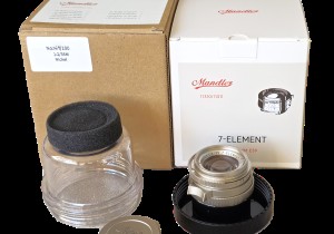 mwc20251226-141 Mandler 35mm f2 7-Element NICKEL Leica M Mount lens (No. 064/100) Limited Edition of 100 only. With Front Cap, Keeper Case, Square Black lens Hood (12526), Round Chrome Lens Hood with Vents (12504), UVa Filter, All Boxed & with Lens Outer Box