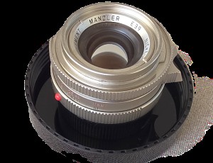 mwc20251226-143 Mandler 35mm f2 7-Element NICKEL Leica M Mount lens (No. 064/100) Limited Edition of 100 only. With Front Cap, Keeper Case, Square Black lens Hood (12526), Round Chrome Lens Hood with Vents (12504), UVa Filter, All Boxed & with Lens Outer Box