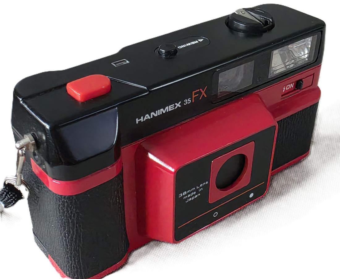 mwc20260109-162 Hanimex 35 FX Red coloured 35mm Compact Point-&-Shoot camera with 38mm lens + Wrist Strap