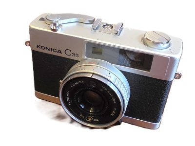 Konica C35 35mm CDS metered Coupled Rangefinder camera, chrome, with 35mm f2.8 Hexanon lens +front cap & ER case