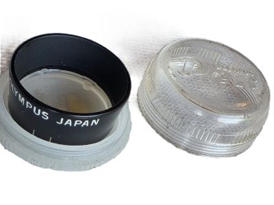 Olympus 24mm push-on Black metal lens hood for Pen Compact half-frame cameras + Olympus keeper case. UNCOMMON