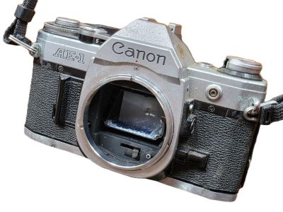 Canon AE-1 35mm SLR chrome body. UNTESTED