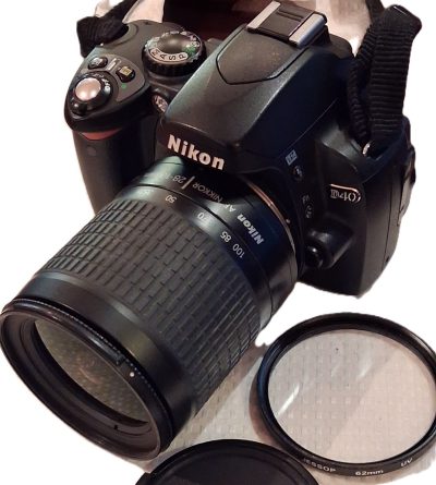 Nikon D40 Digital SLR + Nikon 28-100mm f3.5-5.6 G AF Nikkor, with Jessops UV filter, front cap, Nikon Strap, Nikon EN-EL9 Battery & Jessops small case with strap. No charger